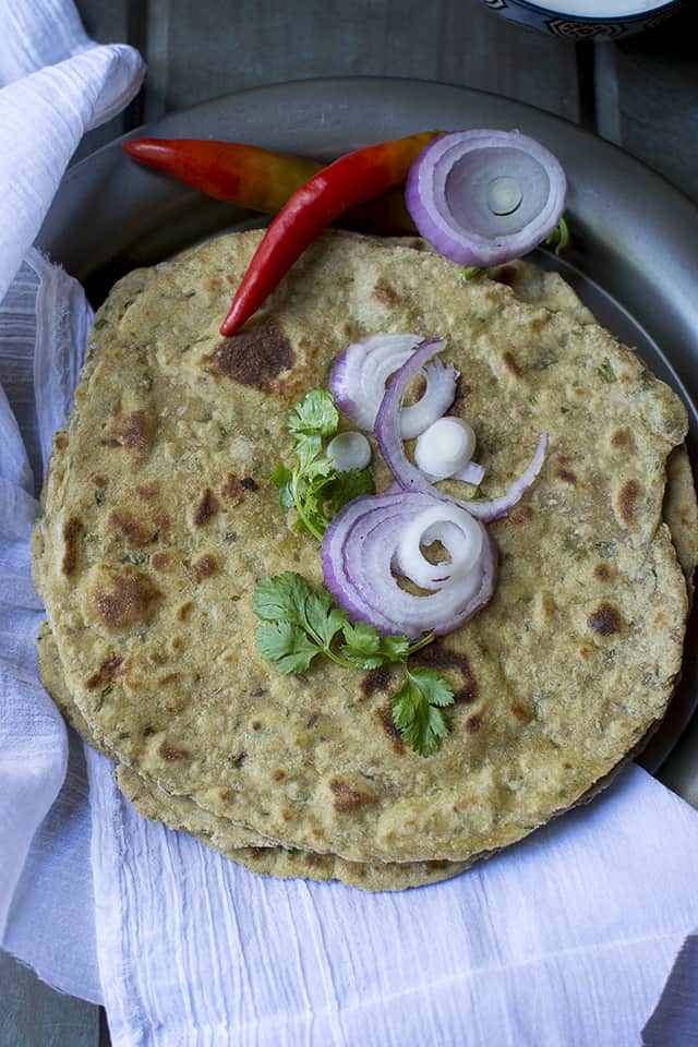 Maharashtrian flatbread served with onions and chilies