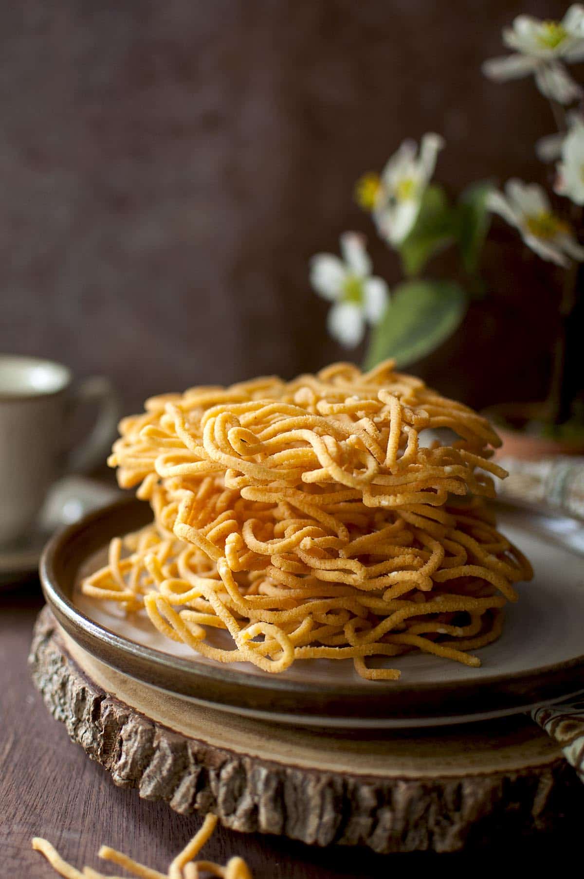 Brown plate with a stack of Janthikalu