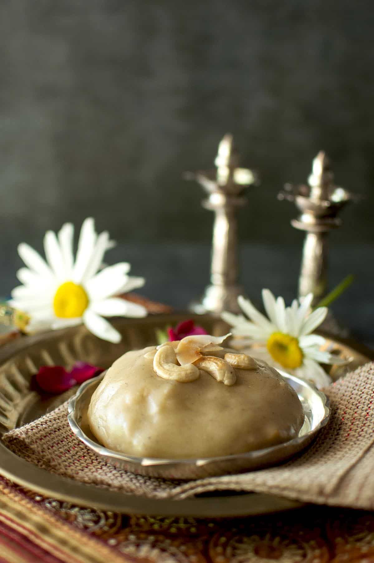 Silver plate with salividi topped with toasted cashews and coconut flakes