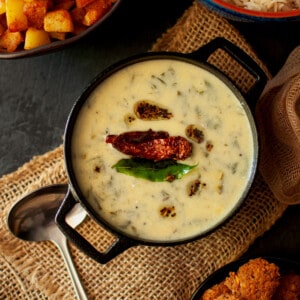 Black pan with kadhi pakoda.