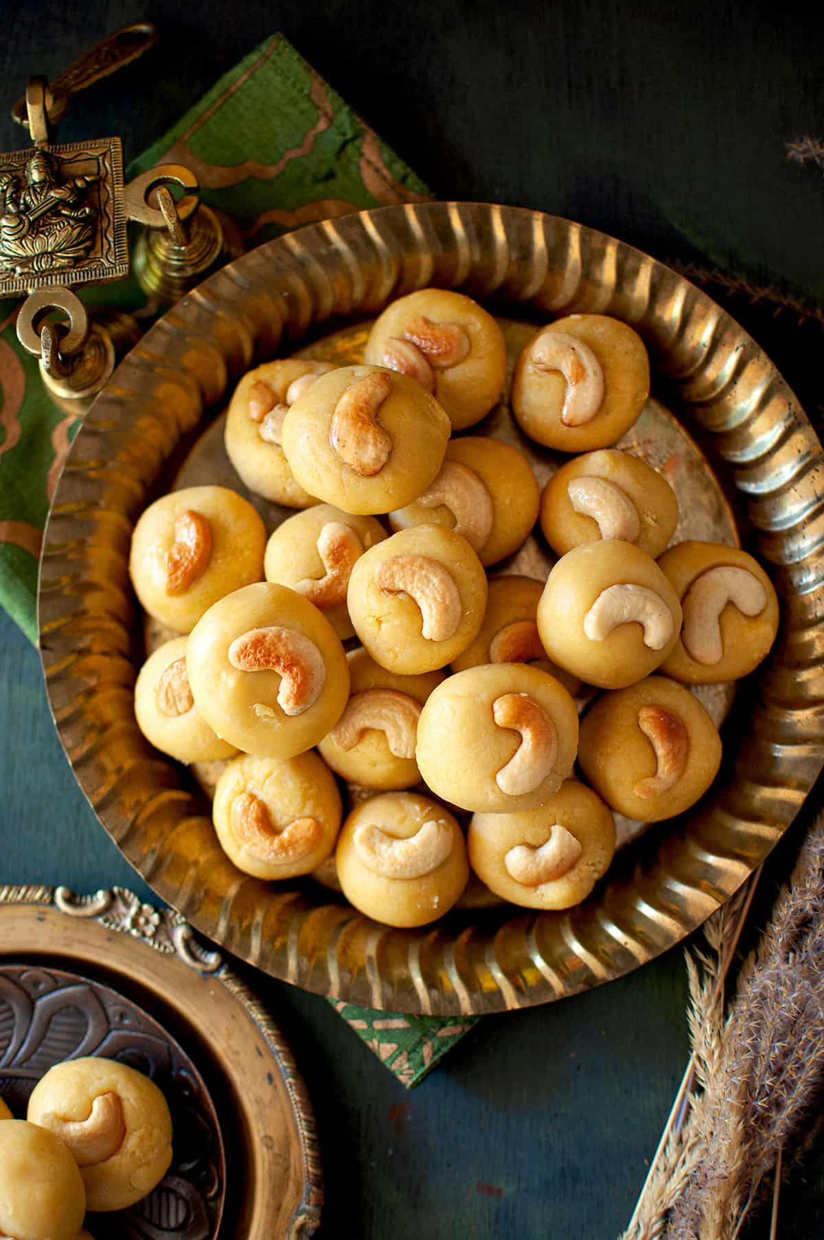 Golden plate with a stack of thokkudu laddu.