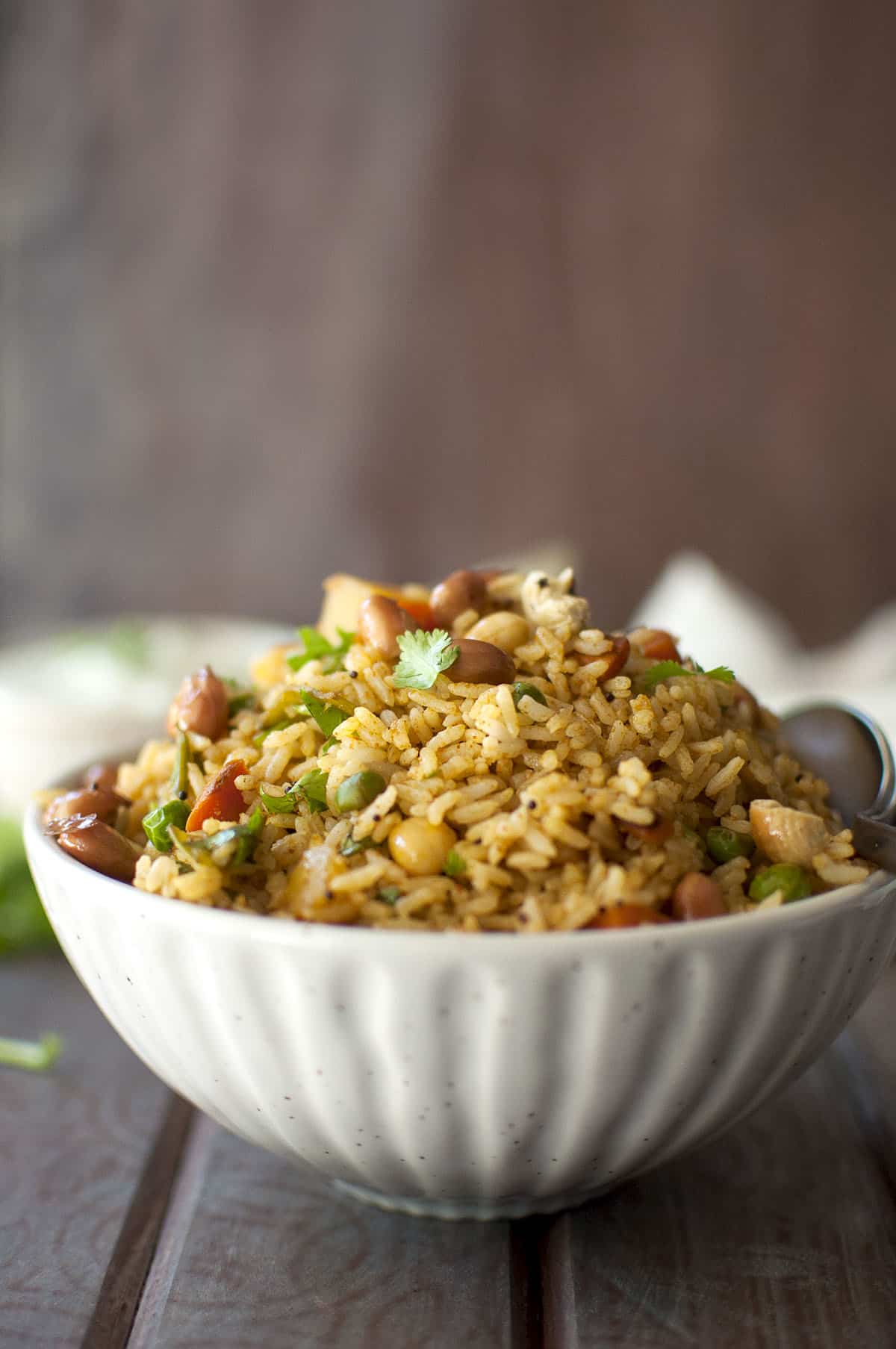 White bowl filled with mixed vegetable rice