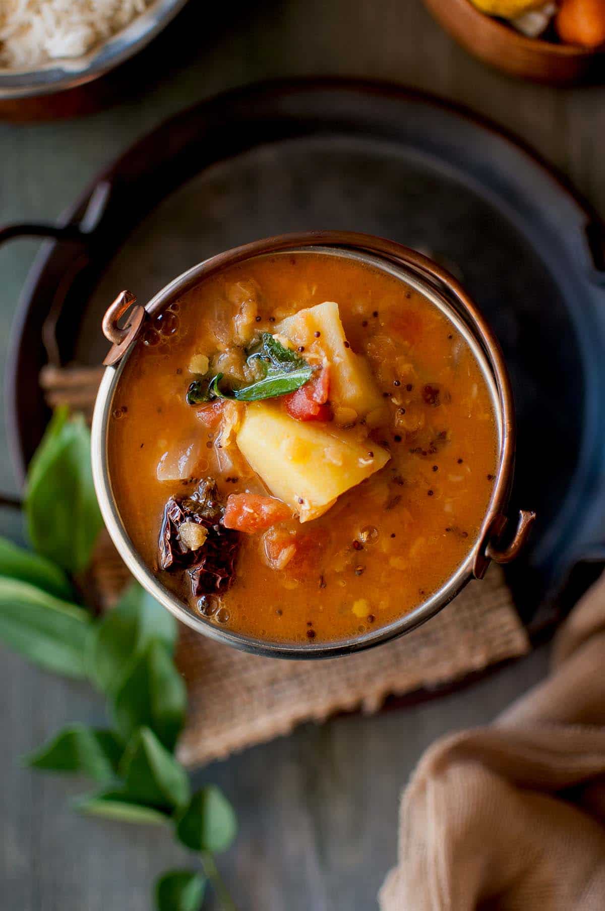 Top view of a bowl with slow cooker sambar