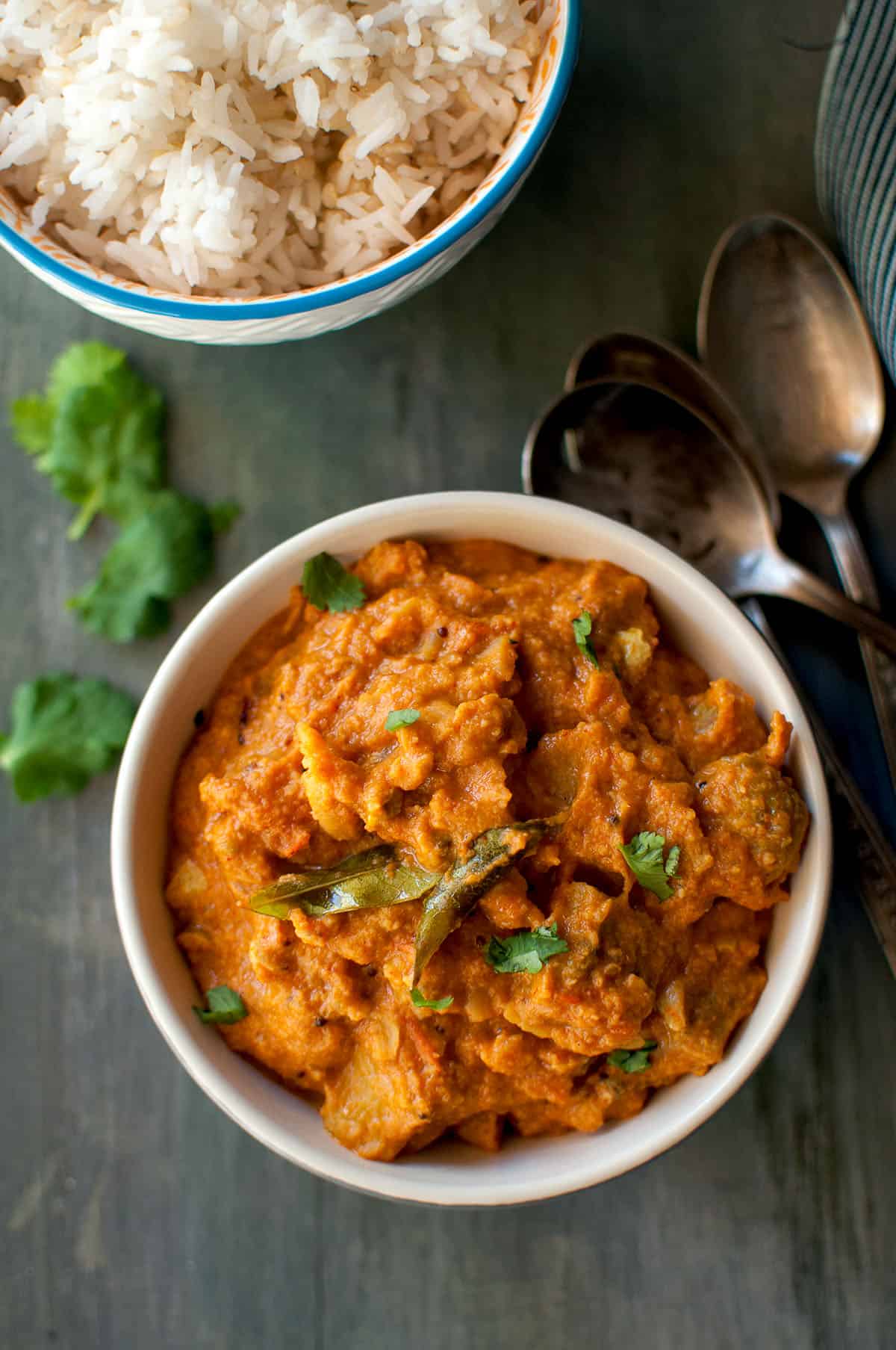 Top view of a bowl with kakarakaya masala curry.