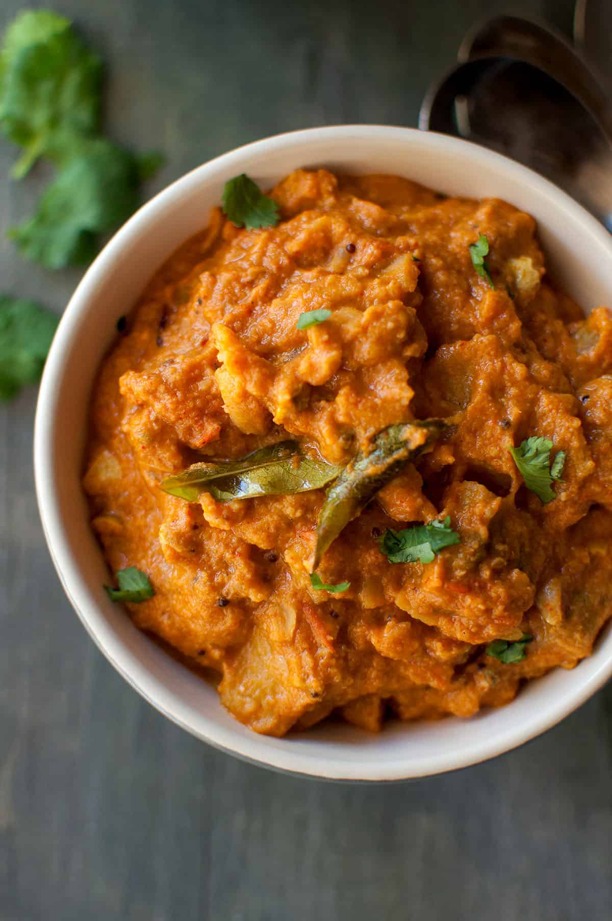 Bowl with kakarakaya masala curry.