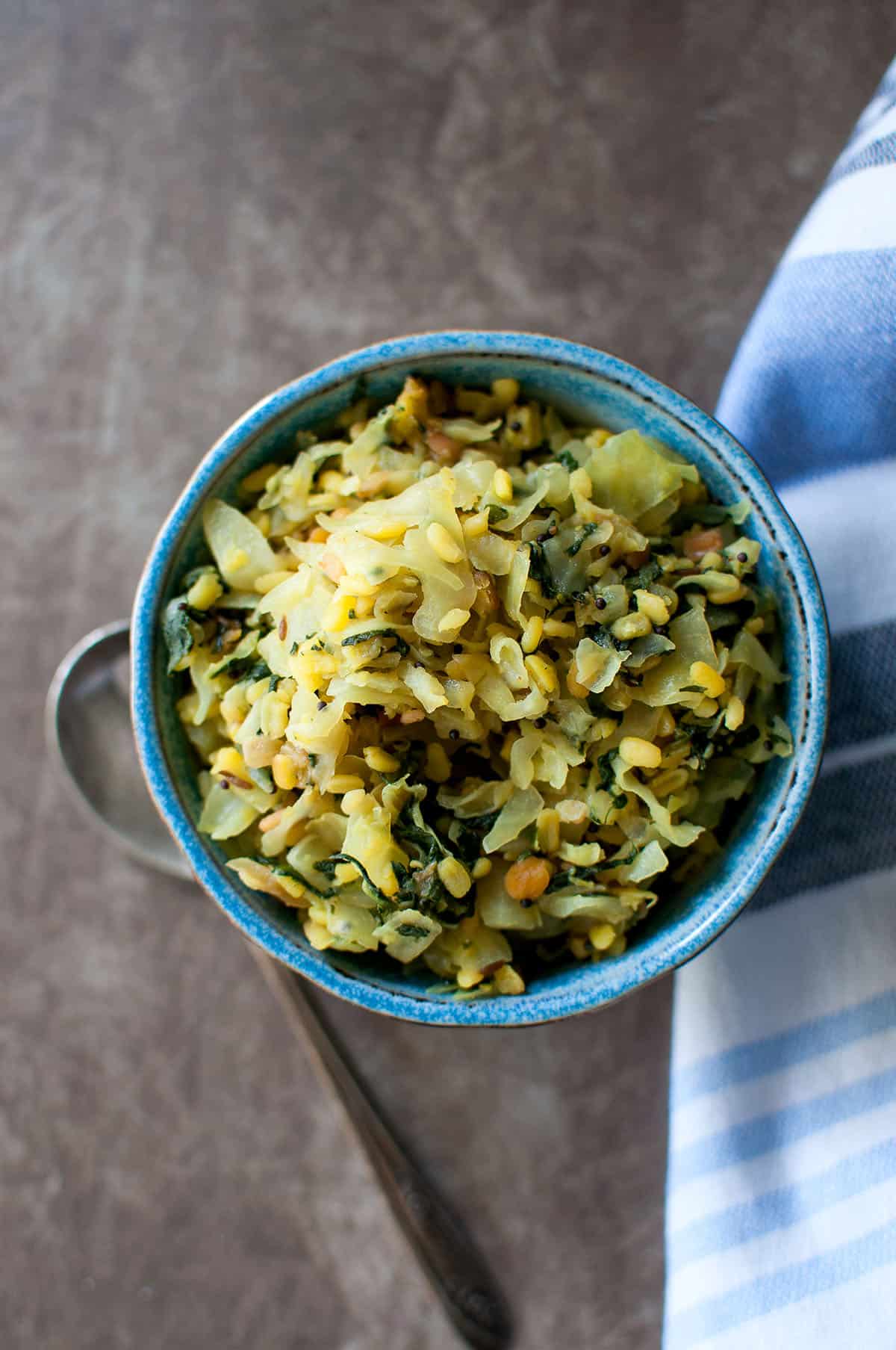 Blue bowl with cabbage pappu kura.