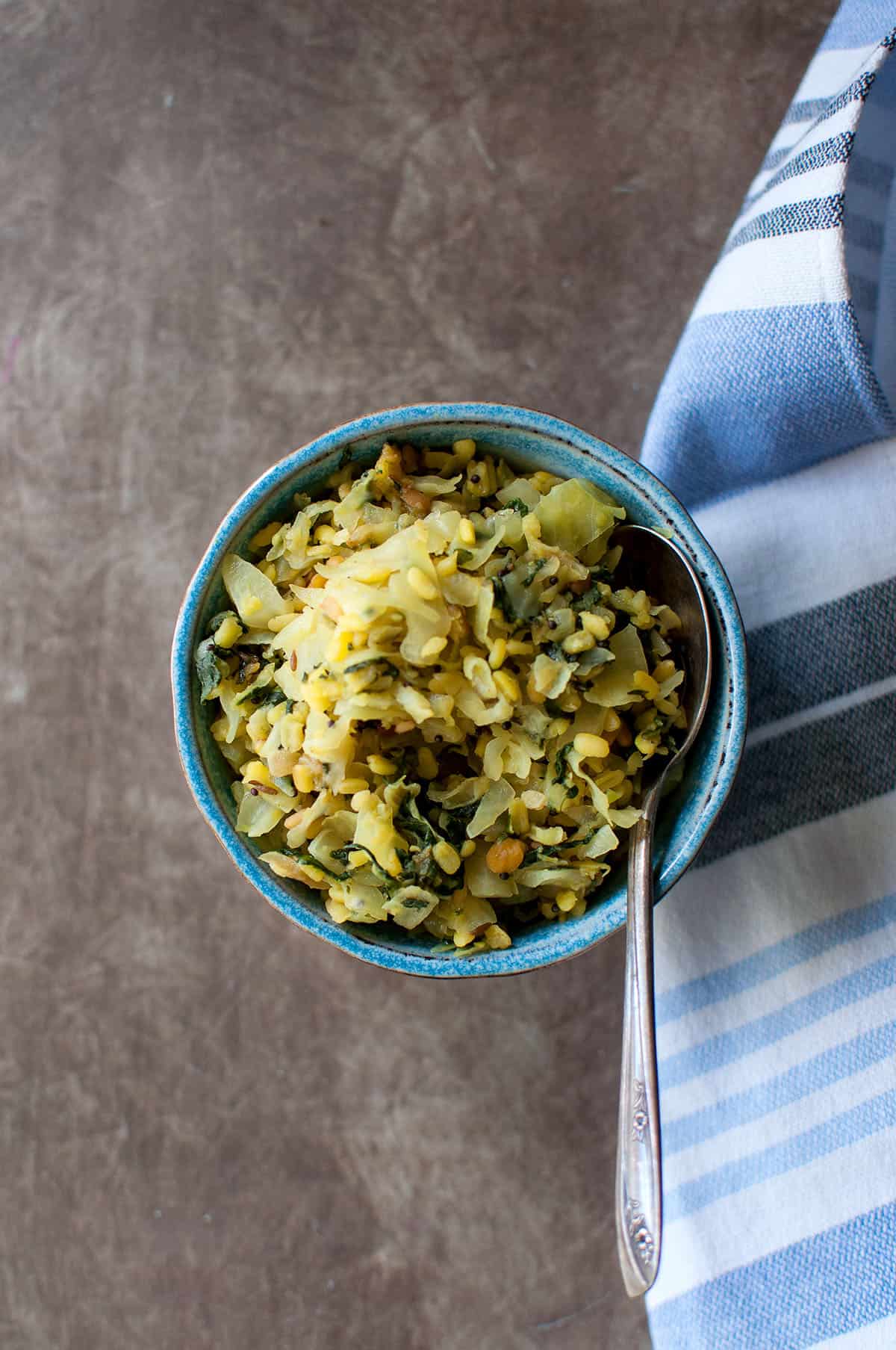 Blue bowl with cabbage spinach recipe.