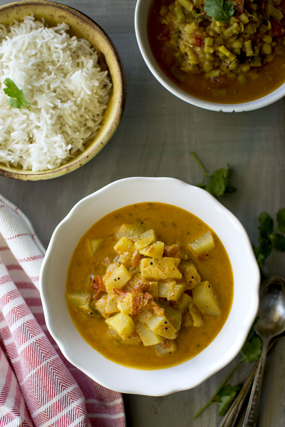 White bowl with Chayote Curry with bowl of rice