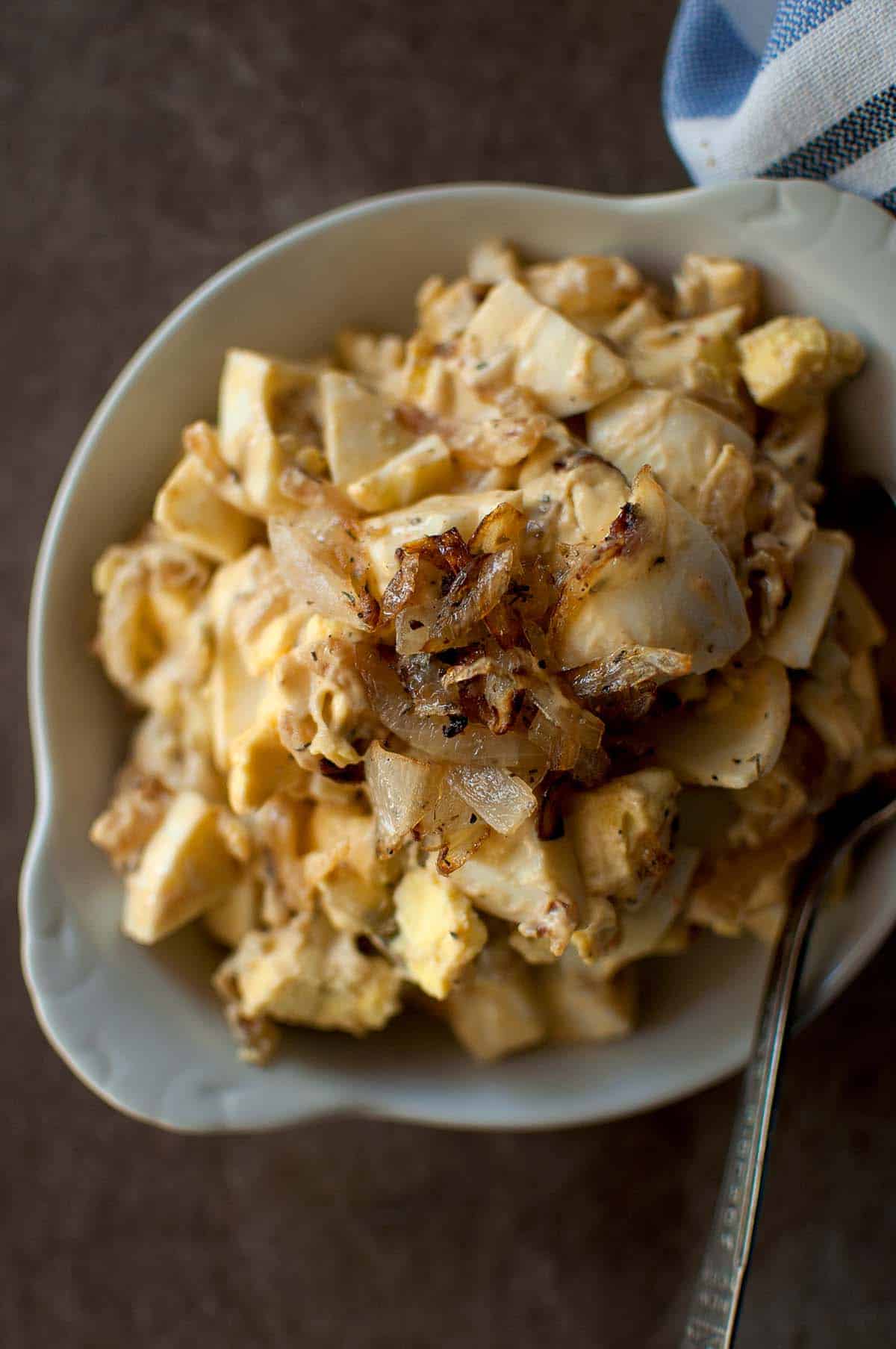 Top view of egg salad with onions.