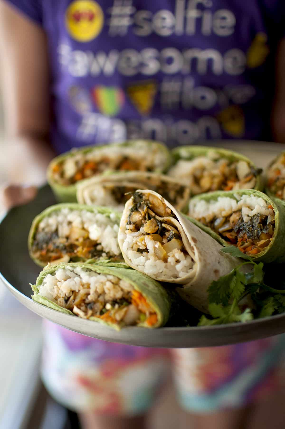 a steel tray of vegetable wraps.