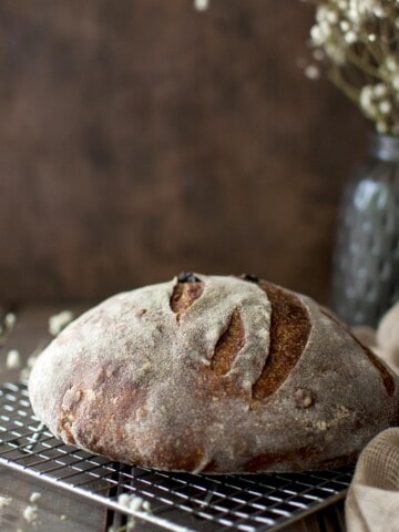 Wire rack with a boule of sourdough bread