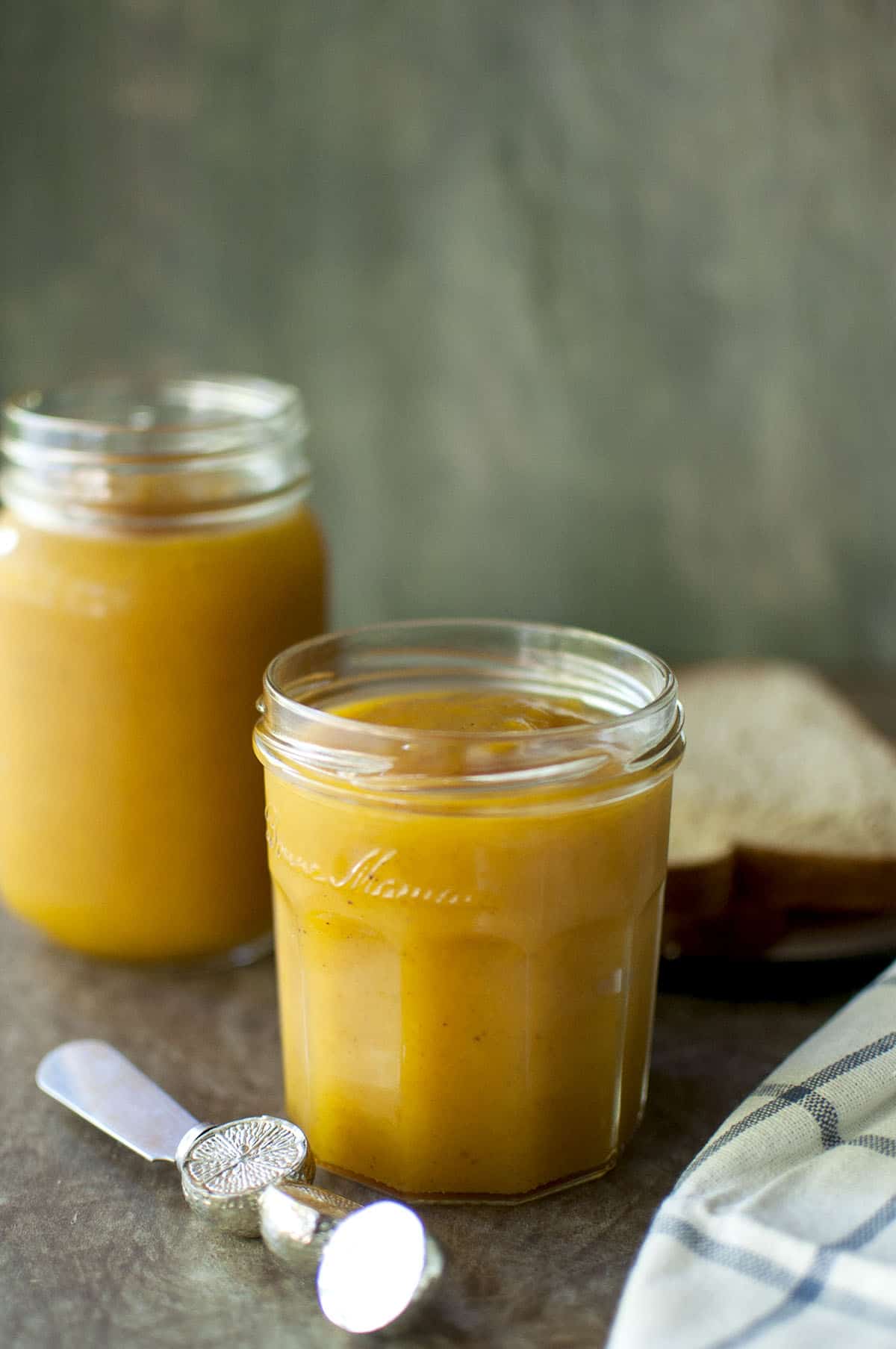 Glass jars with peach and mango jam