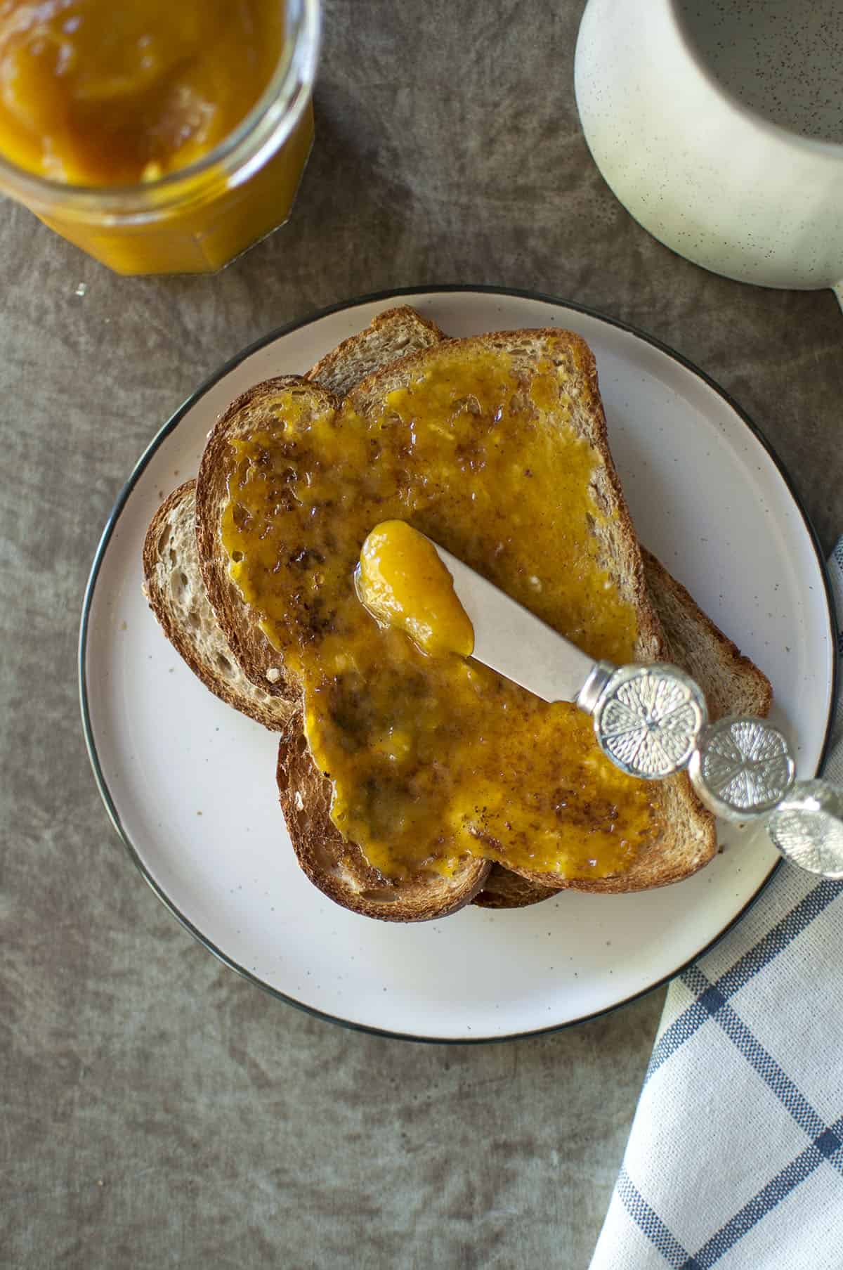 White plate with toast with jam