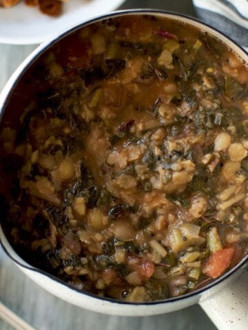 Top view of a pan with amaranth greens dal