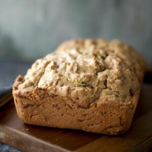 zucchini loaf placed on a chopped board