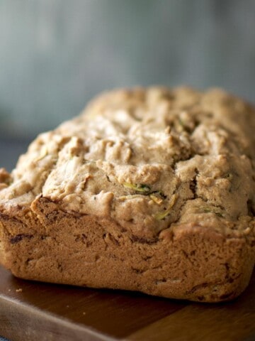 zucchini loaf placed on a chopped board