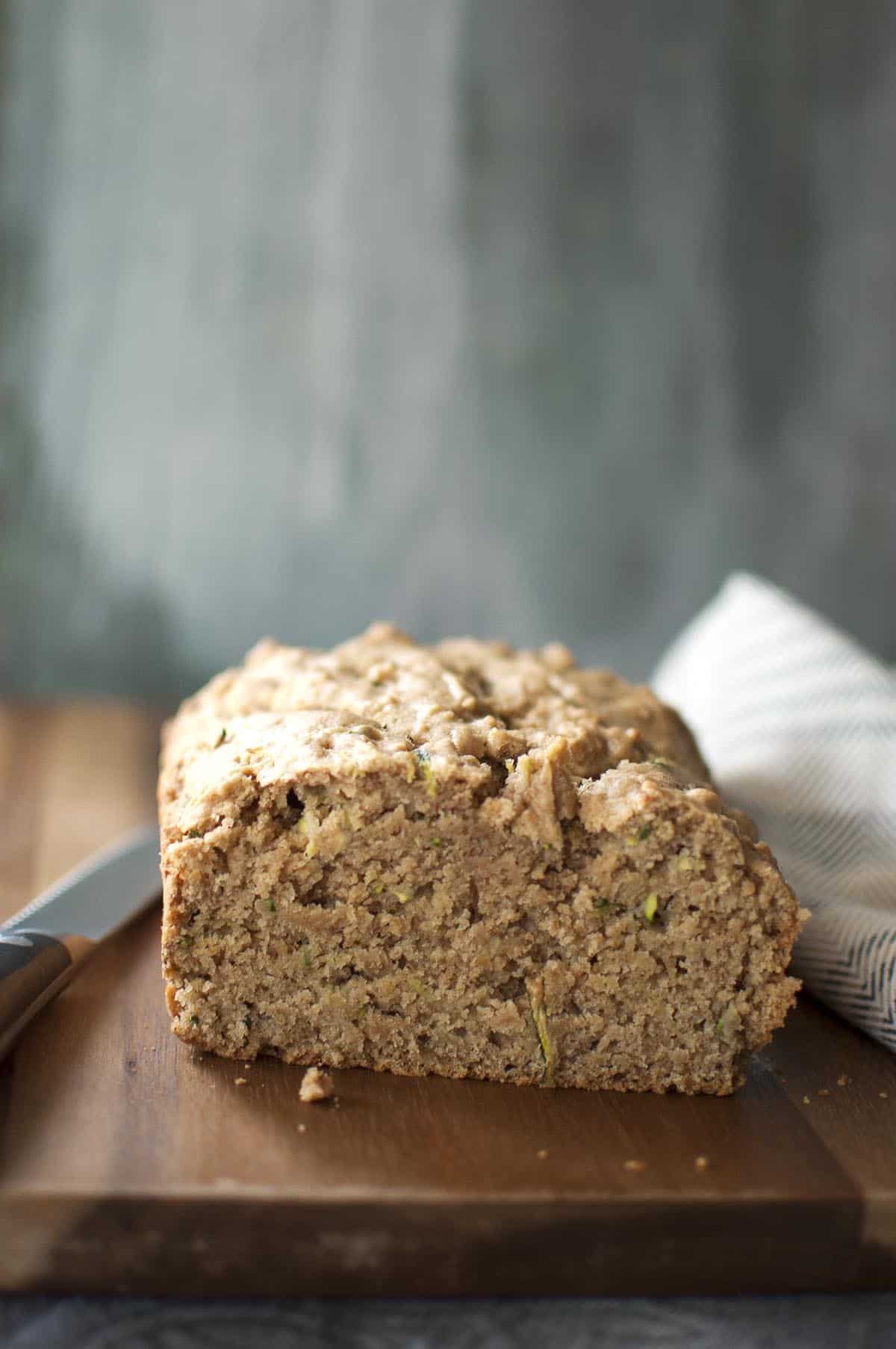 chopped sourdough zucchini bread placed on a chopped board