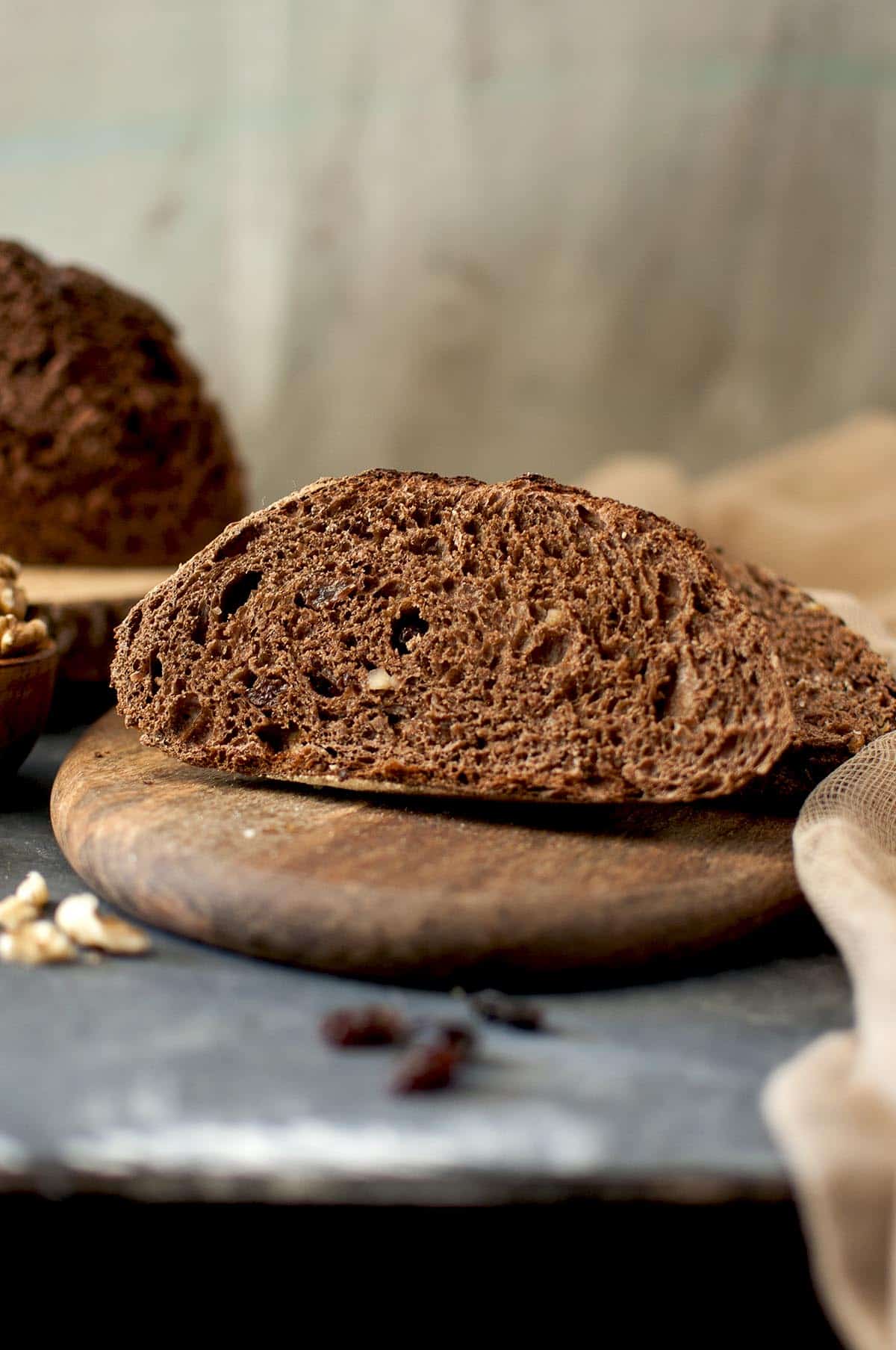 chopping board with a slice of chocolate sourdough bread