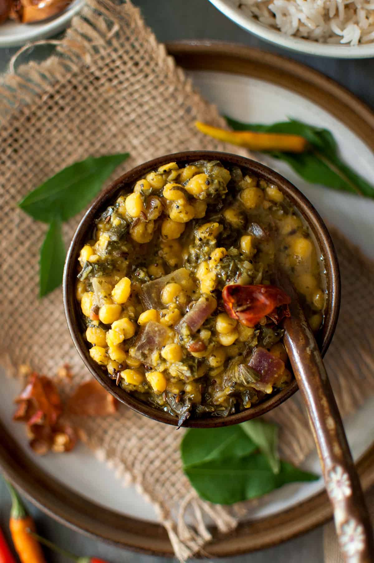 Round brown bowl with dal.