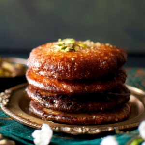 Plate with a stack of Bengali malpua.