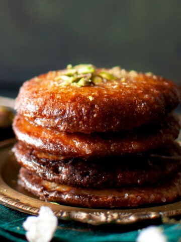 Plate with a stack of Bengali malpua.