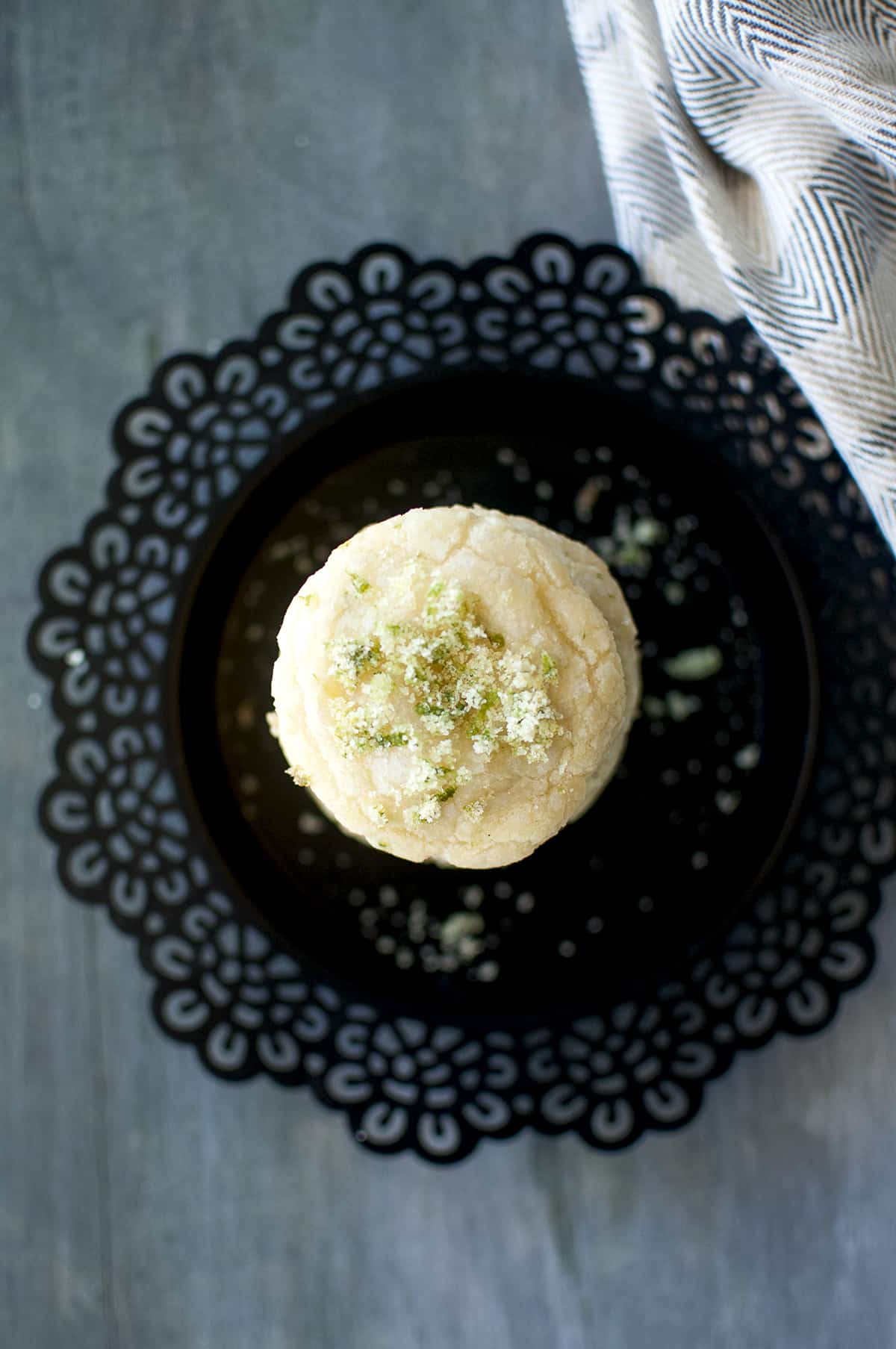 Black plate with a stack of lime sugar sprinkled cookies