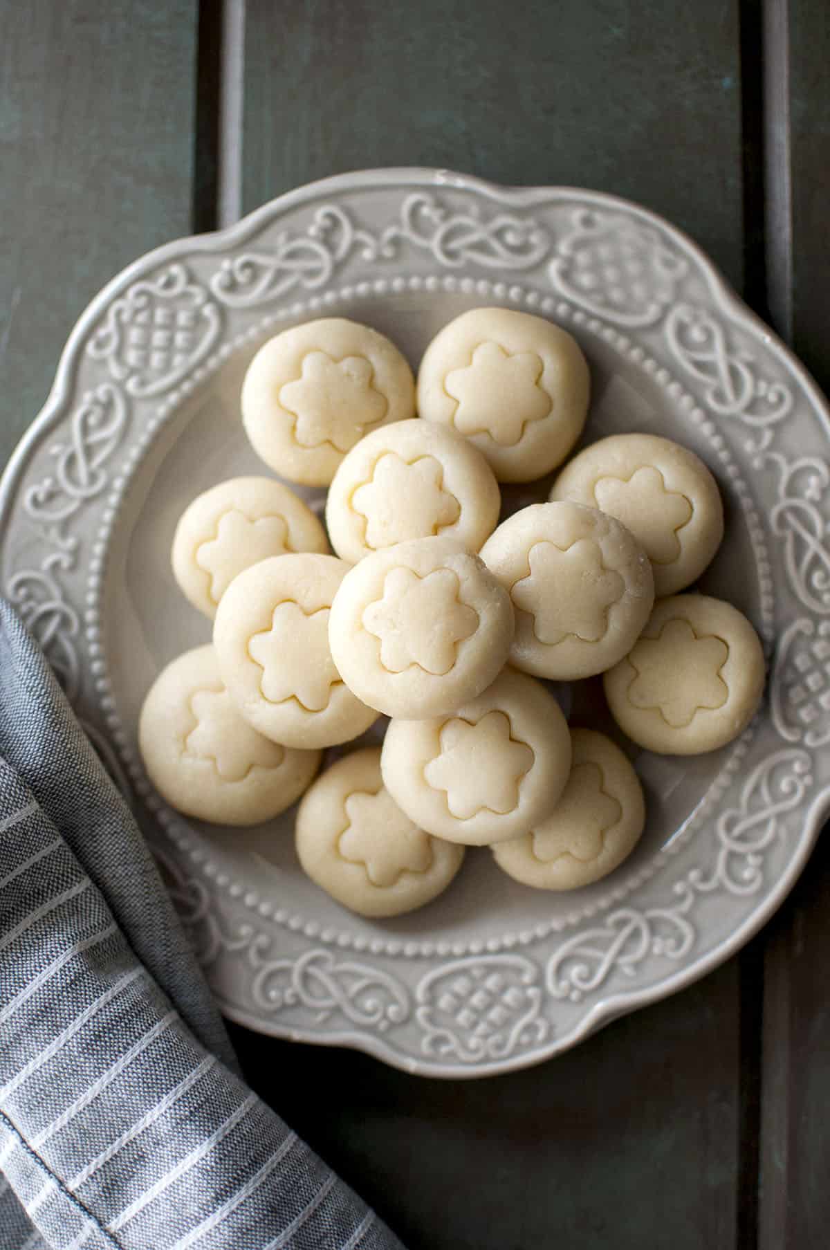 Grey plate with a stack of microwave milk fudge