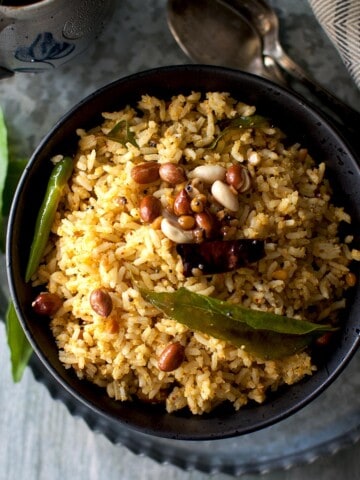 Raw mango rice in black bowl