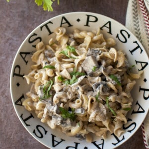 White bowl with mushroom pasta