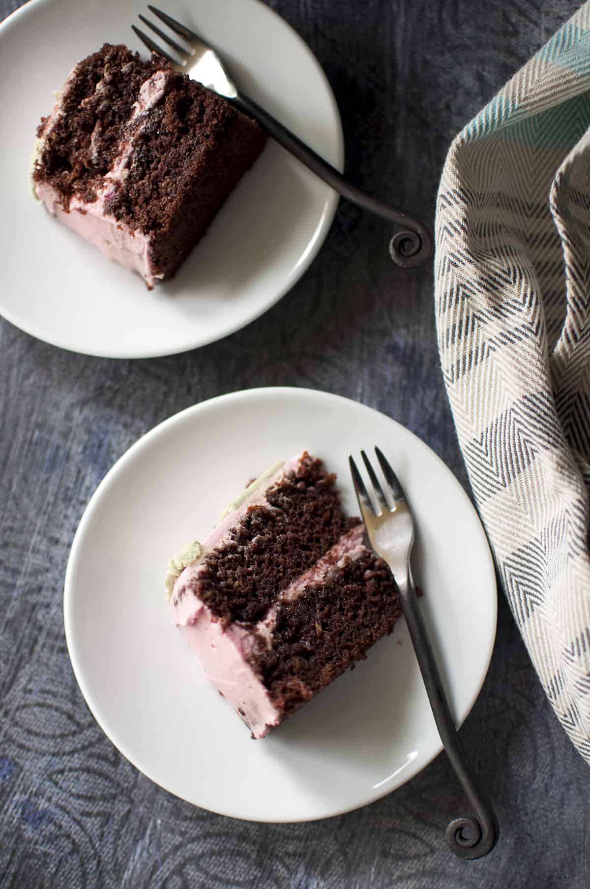 2 White plates with chocolate cake slices