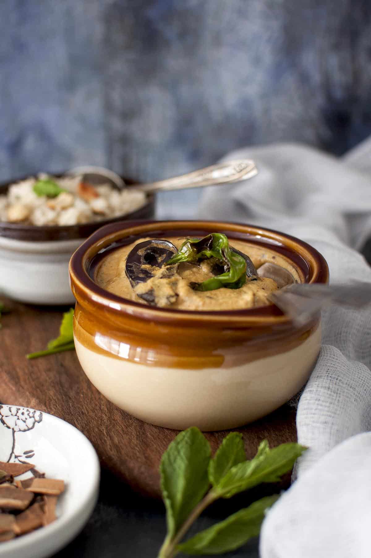 Brown bowl with eggplant chili curry