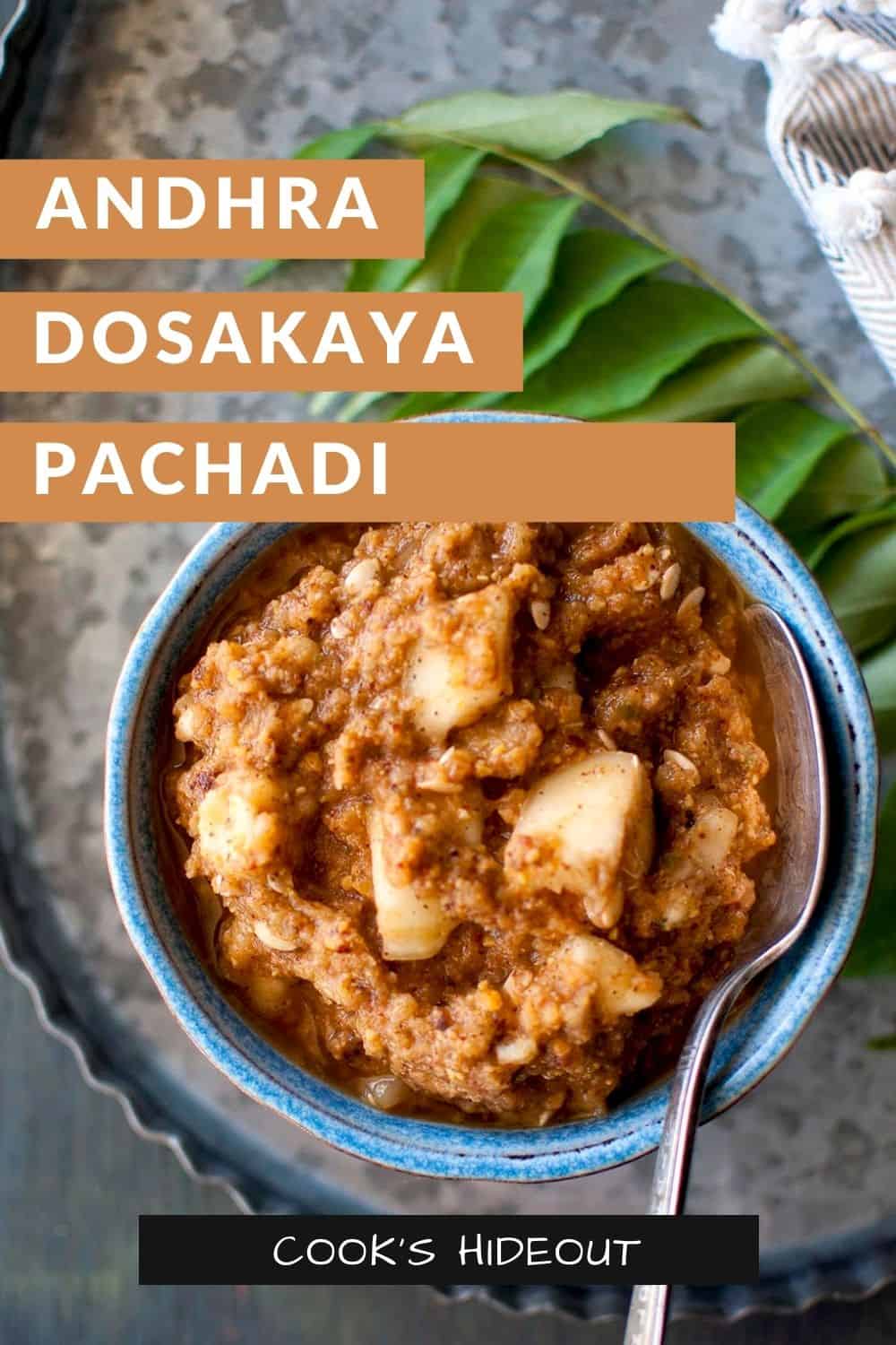 Blue bowl with dosakaya pachadi with a spoon inside