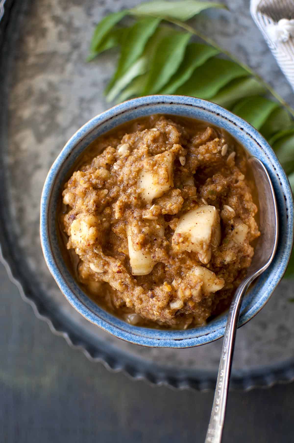 top view of dosakaya pachadi in a blue bowl