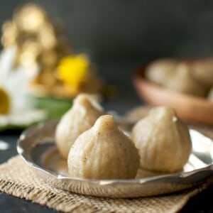 Silver plate with 3 jowar modak