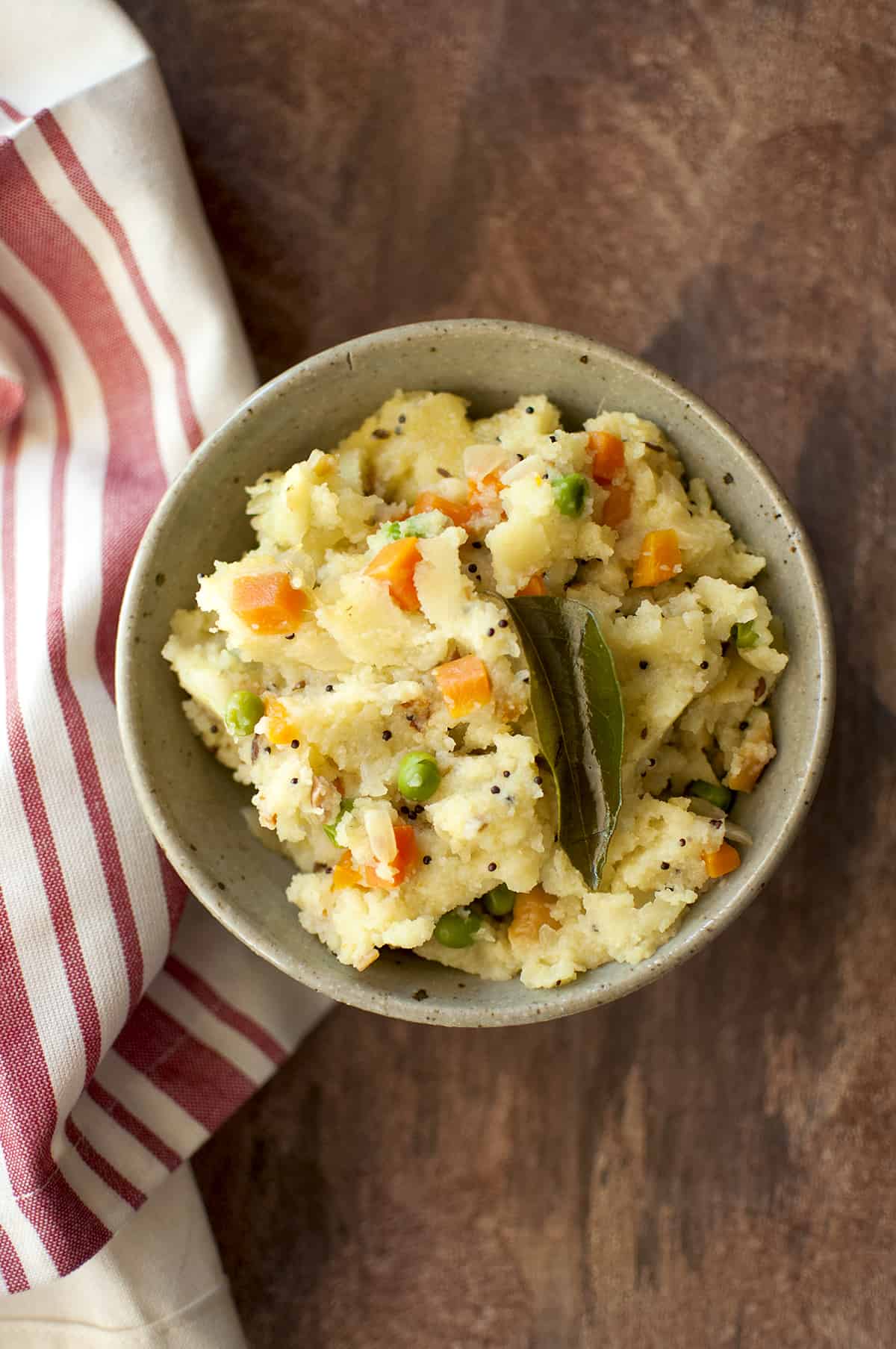 Grey bowl with vegetable upma