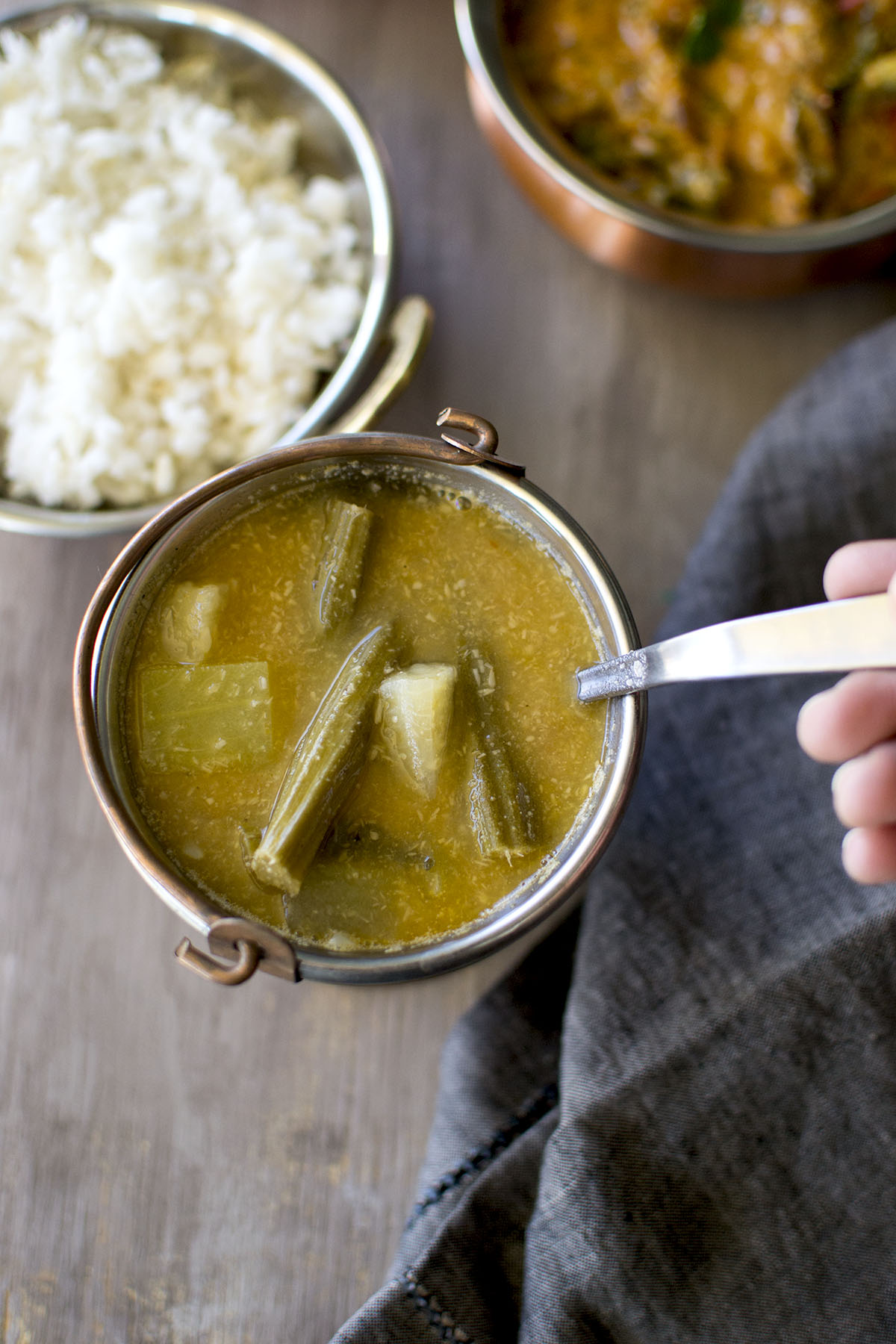 Copper bowl with vegetable showing in sambar