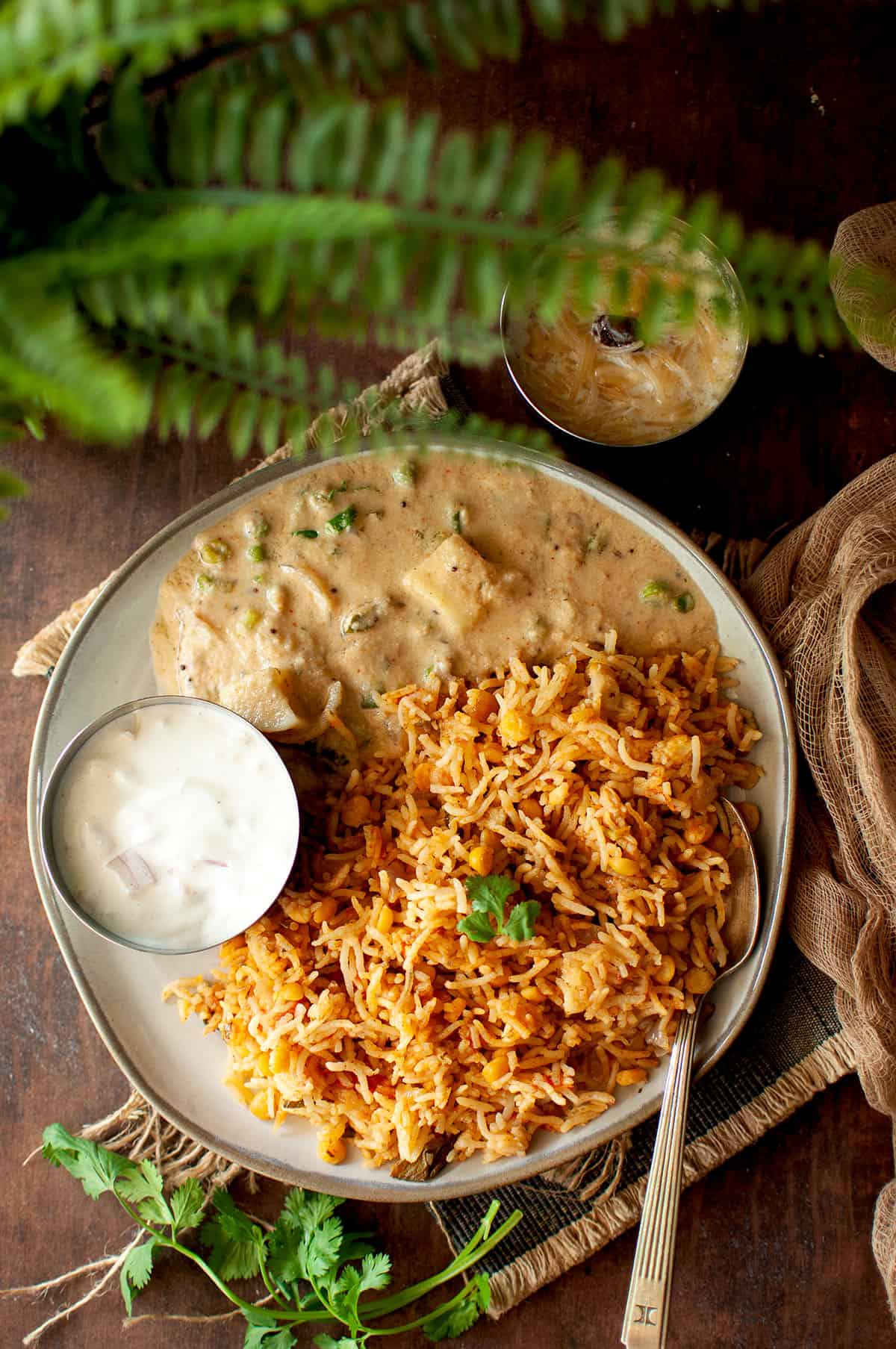 Grey plate with qabooli, salan and raita.