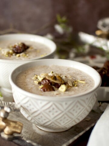 2 bowls of sheer khurma on a silver tray