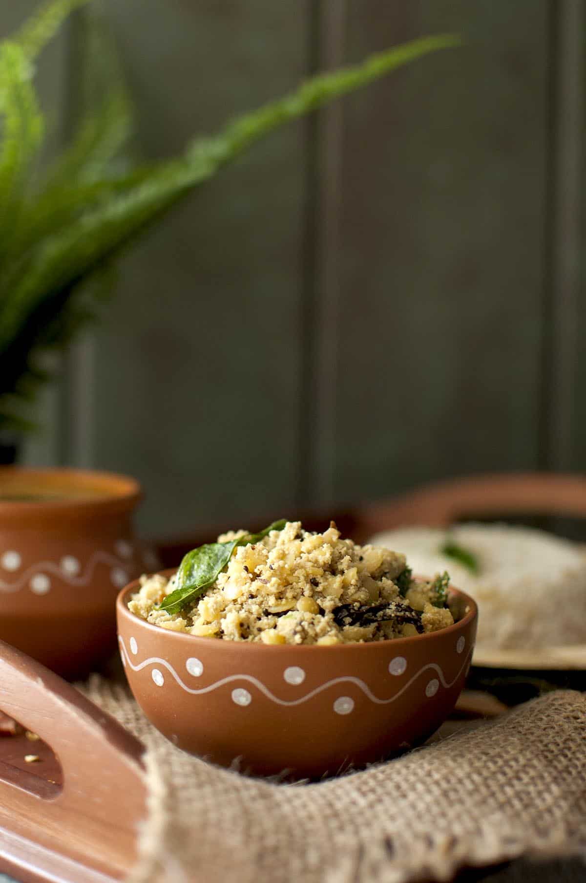 Terracotta bowl with sesame seeds lentil curry