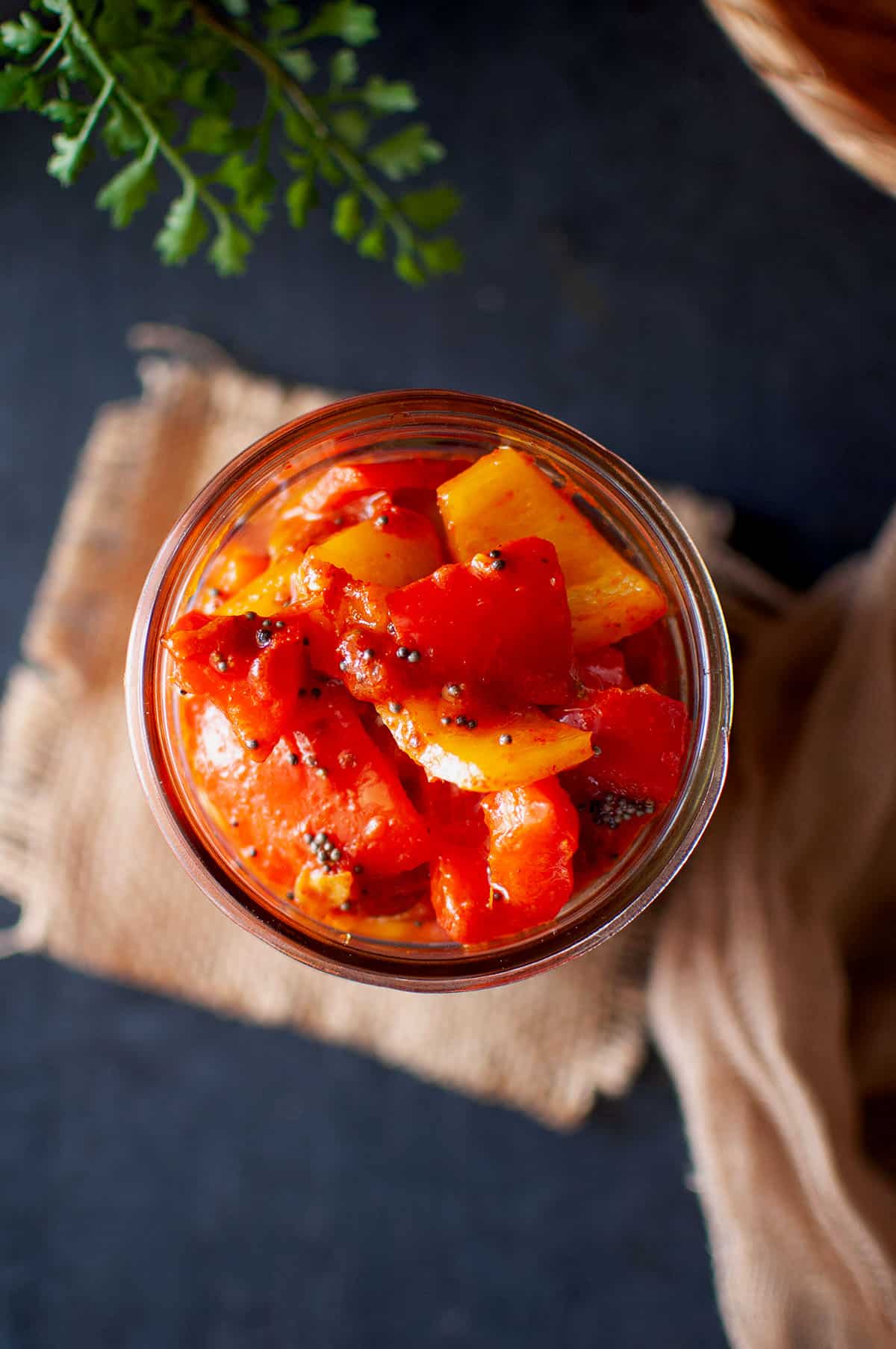 Top view of mason jar with capsicum pickle.