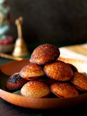 Plate with a stack of unniyappam.