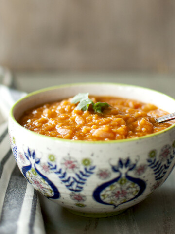 White bowl with Ethiopian red lentil stew.