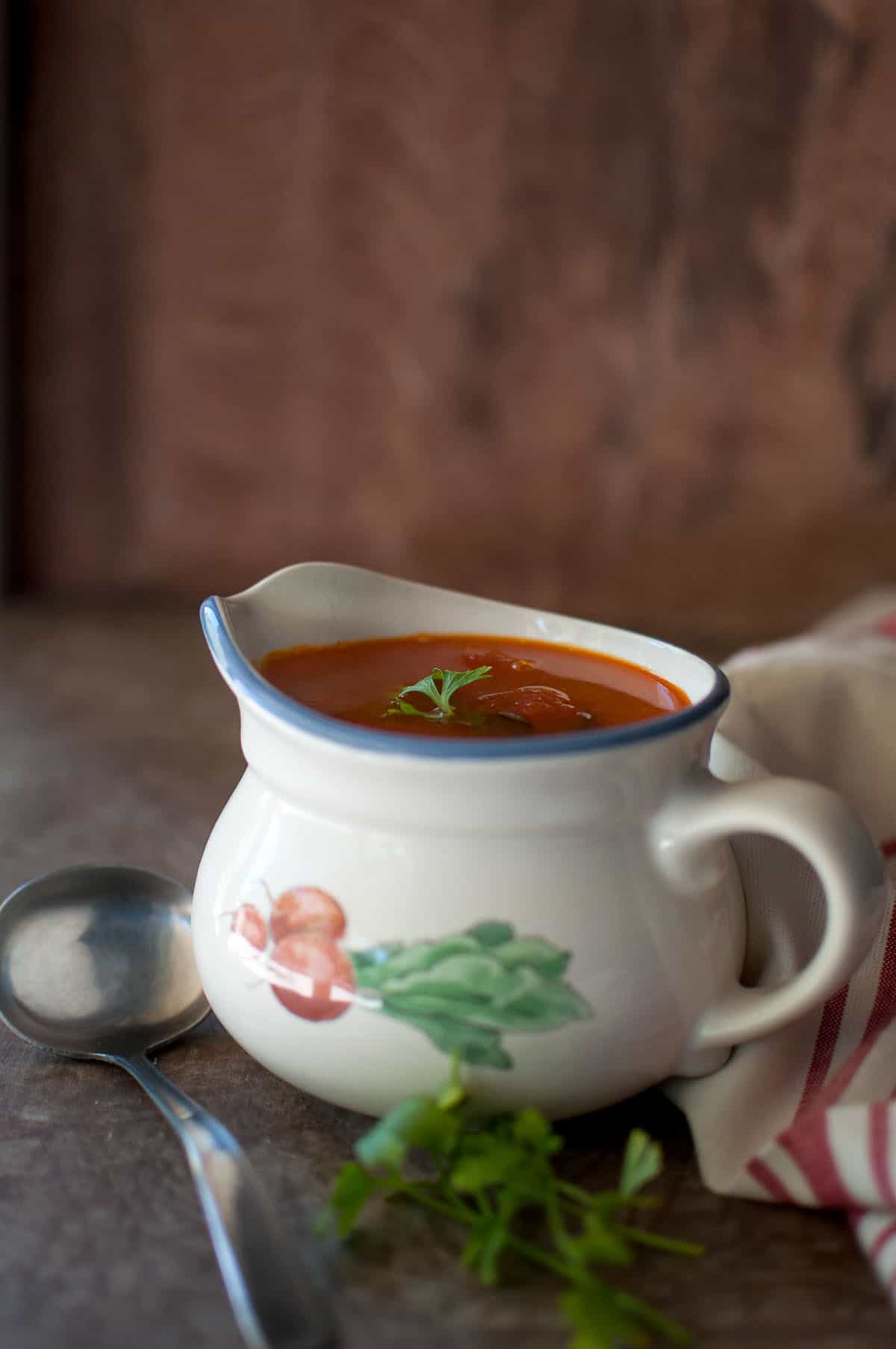 White bowl with mixed dal rasam.