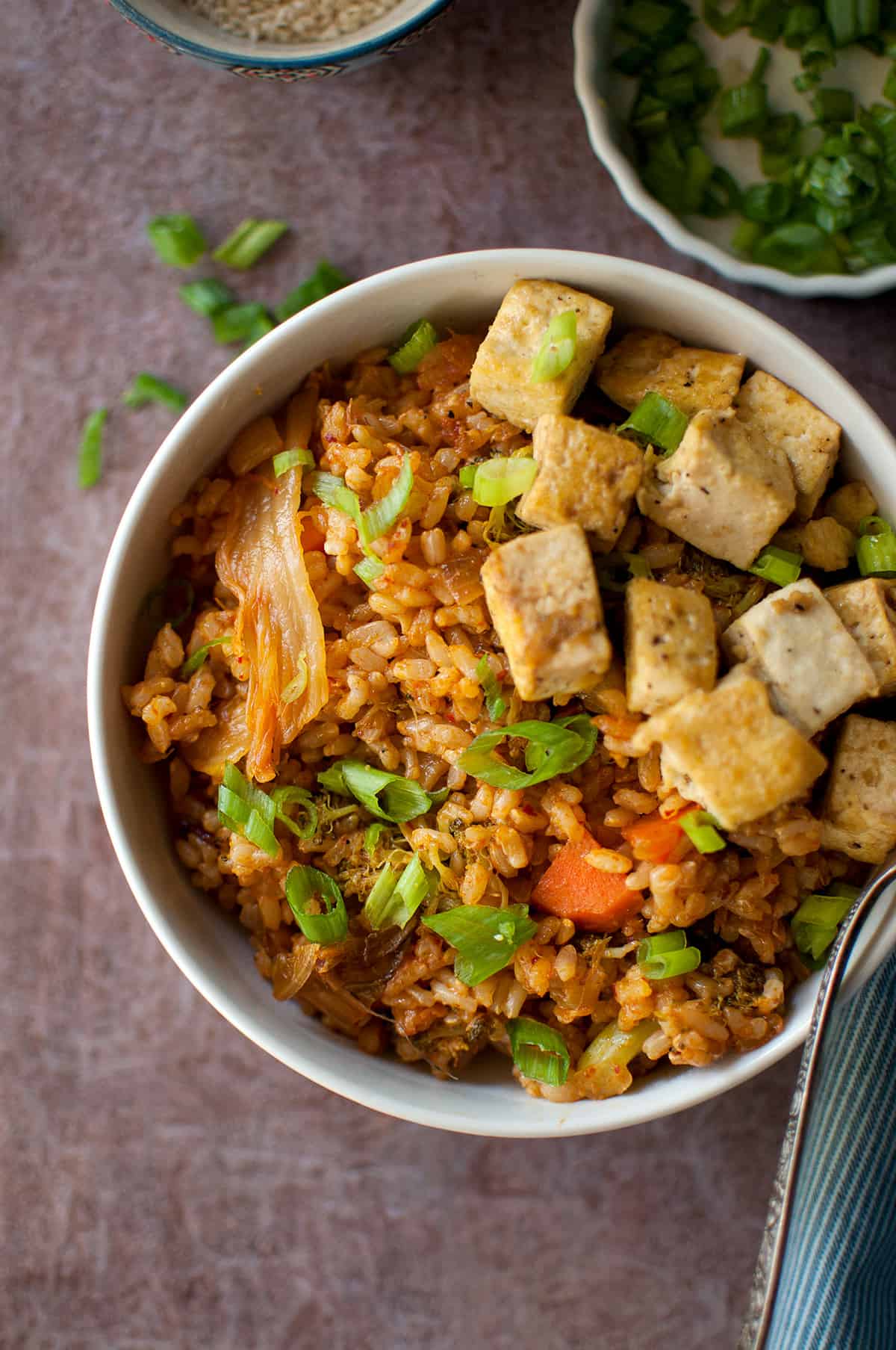 White bowl with vegetarian Korean fried rice with tofu.