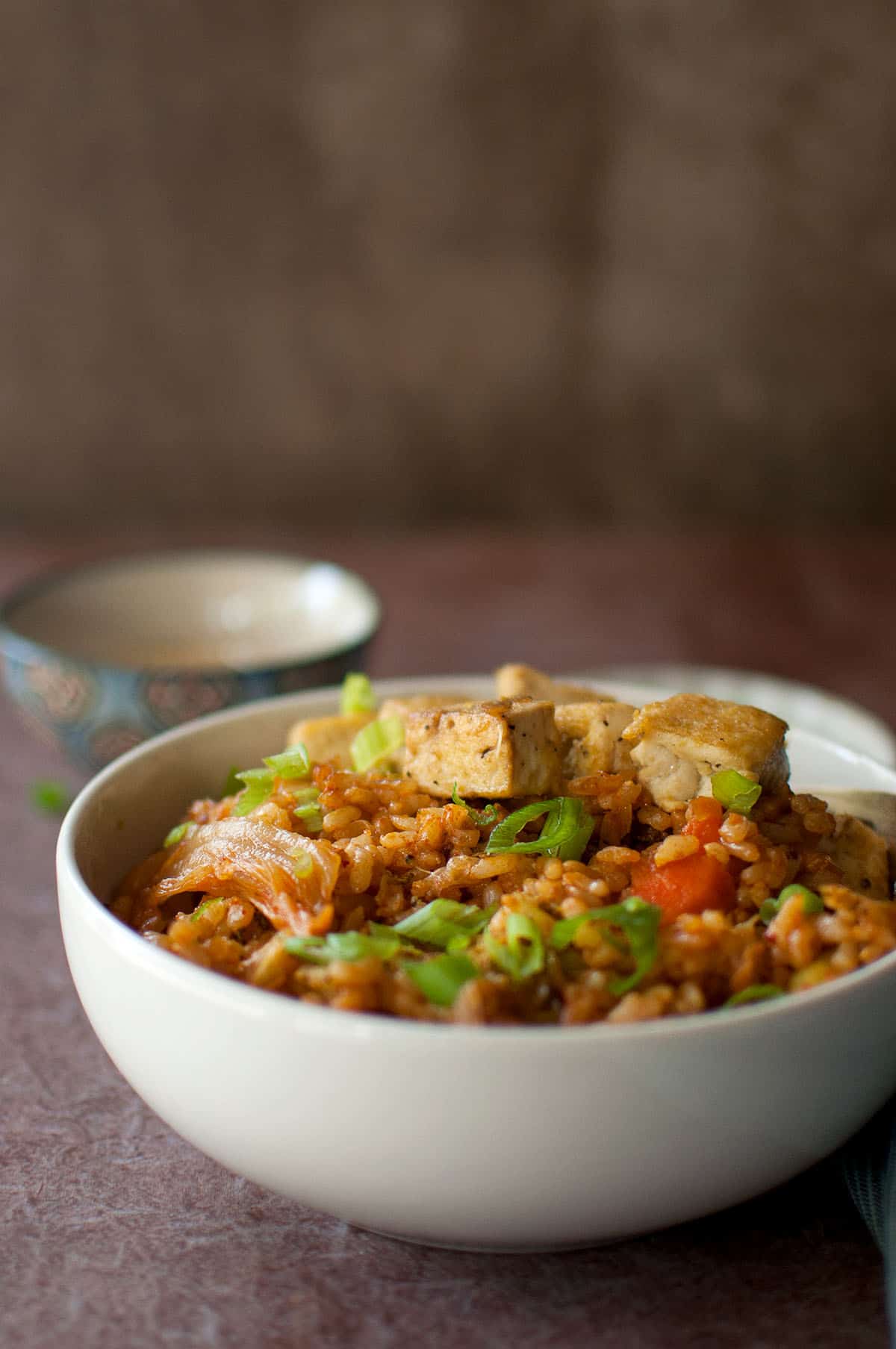 White bowl with vegetarian kimchi fried rice.