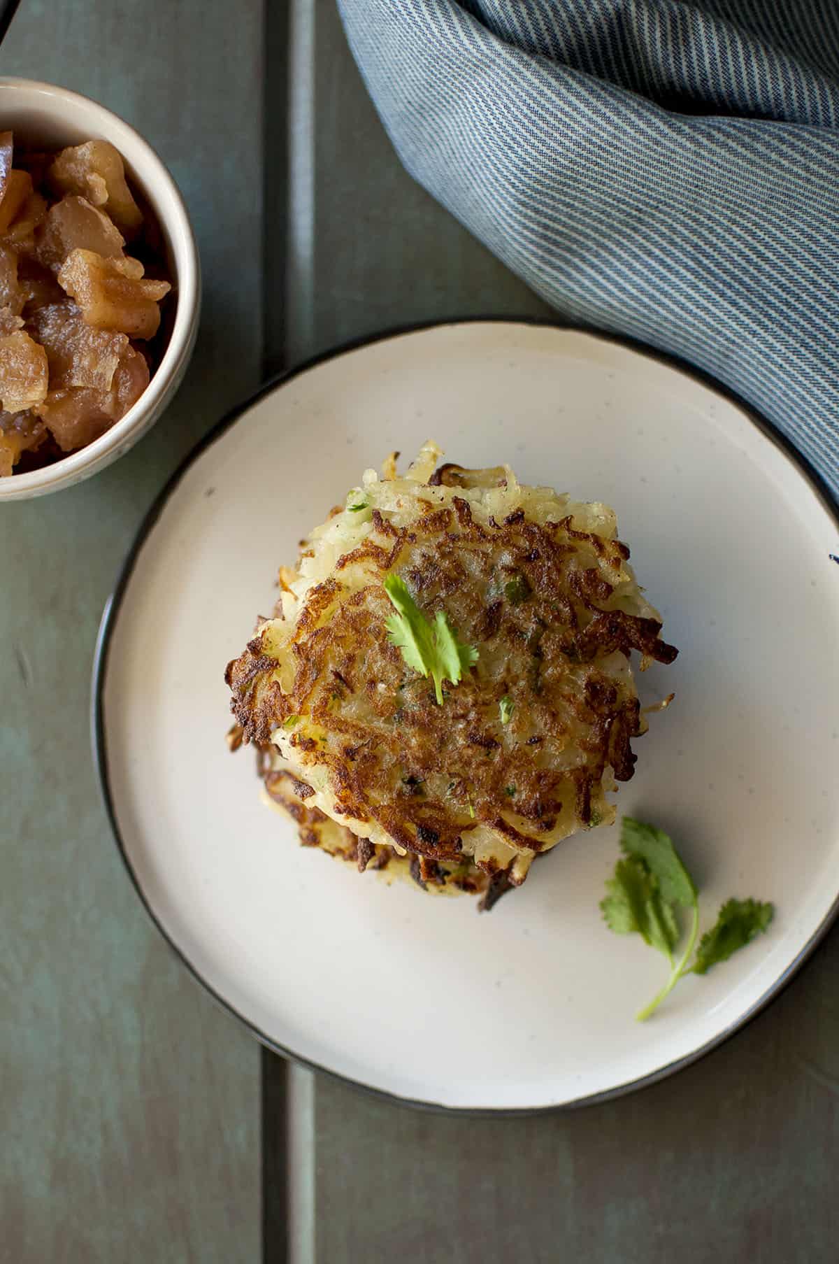 Grey plate with crispy potato pancakes