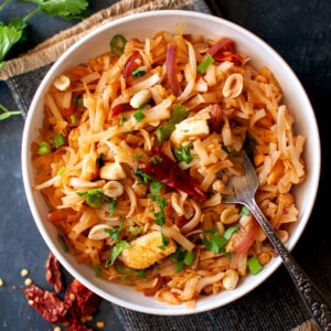 White bowl with noodle stir fry.