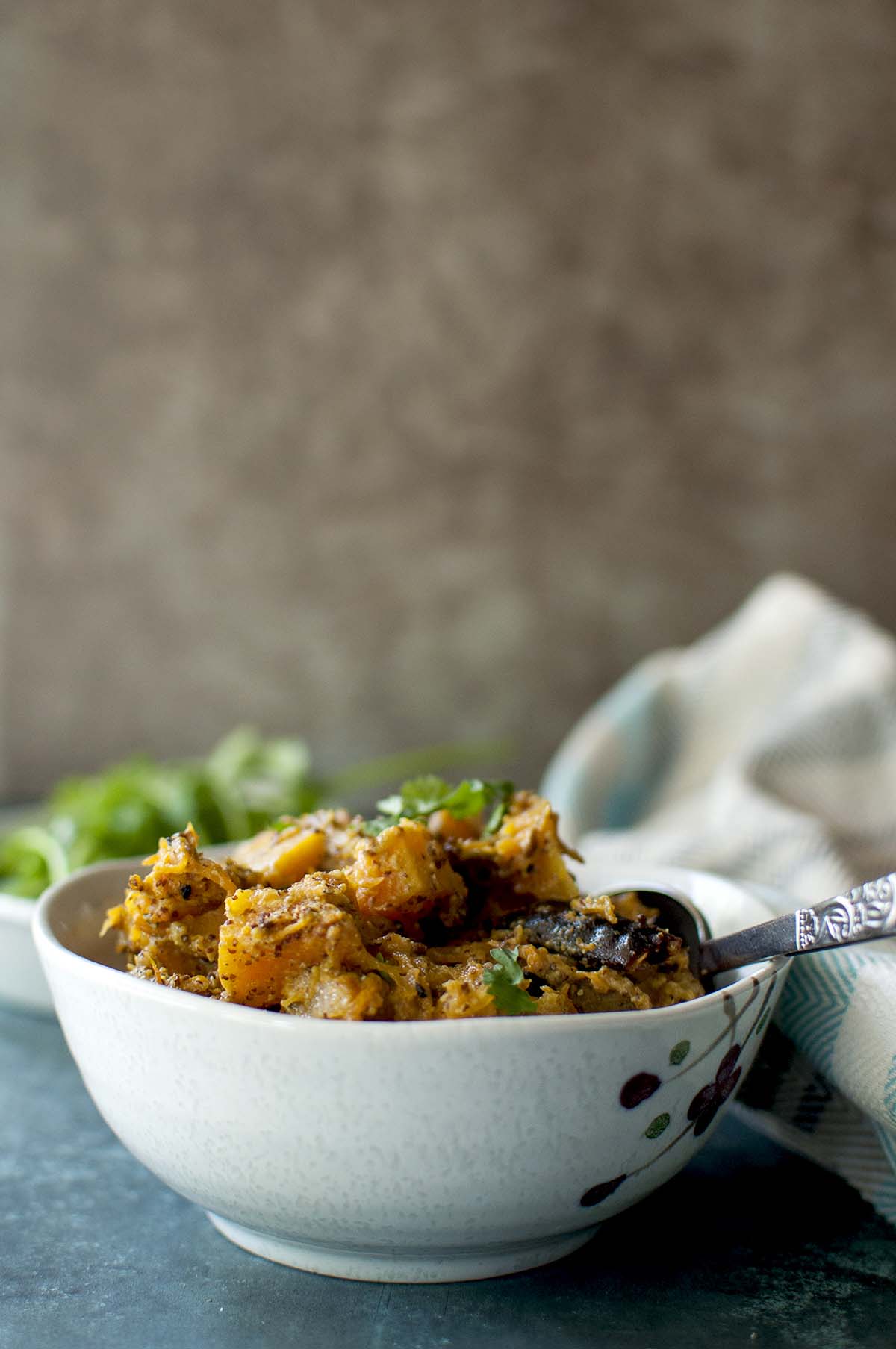 White bowl with kaddoo ki sabzi