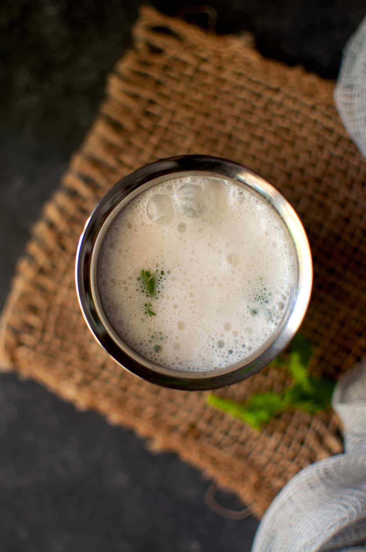 Steel glass with churned buttermilk 