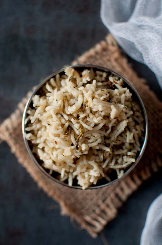 Steel bowl with spinach pulao